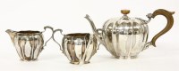 Lot 129 - A three piece tea set