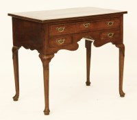 Lot 676 - An inlaid oak lowboy