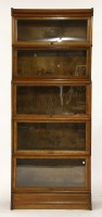 Lot 749 - A five tier oak Globe Wernick sectional book case