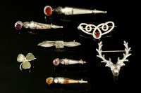 Lot 657 - Eight assorted Scottish silver hardstone or pebble brooches