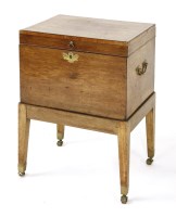 Lot 1066 - A mahogany decanter box and stand