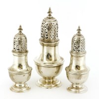 Lot 255 - A set of three George III baluster castors