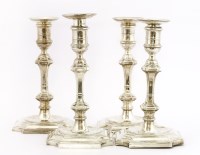 Lot 318 - A set of four silver candlesticks