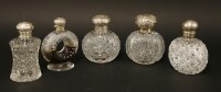 Lot 212 - Four cut-glass cologne bottles
