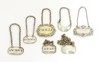 Lot 123 - A collection of silver spice and sauce labels