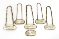 Lot 127 - A set of three George III silver wine labels