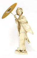 Lot 580 - A Japanese ivory okimono