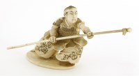 Lot 583 - A Japanese ivory okimono