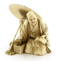 Lot 585 - A Japanese ivory okimono