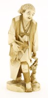 Lot 587 - A Japanese ivory okimono