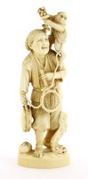 Lot 589 - A Japanese ivory okimono