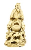 Lot 588 - A Japanese ivory okimono