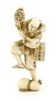 Lot 590 - A Japanese ivory okimono