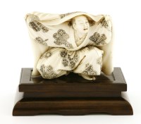 Lot 592 - A Japanese ivory okimono
