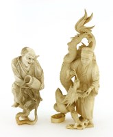 Lot 596 - Two Japanese ivory okimono