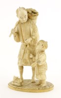 Lot 597 - A Japanese ivory okimono