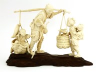 Lot 607 - A Japanese ivory okimono