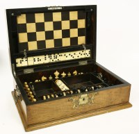 Lot 449 - A Victorian walnut games compendium