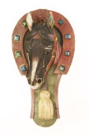 Lot 489 - A carved pine and painted farrier's shop sign