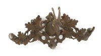 Lot 501 - A Black Forest carved linden wood coat hook