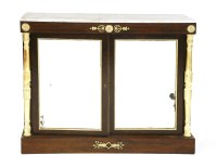 Lot 1179 - A Regency rosewood and parcel-gilt cabinet