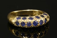 Lot 748 - A gold pavé set sapphire bombe ring