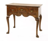 Lot 925 - A walnut and inlaid lowboy