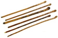 Lot 420 - A quantity of Japanese carved bamboo walking sticks