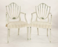 Lot 431 - A pair of Hepplewhite white painted elbow chairs