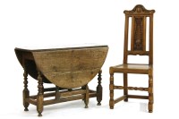 Lot 443 - An oak gate leg table