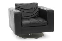 Lot 413 - A Natuzzi black leather swivel armchair