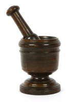 Lot 158 - An antique turned wood pestle and mortar