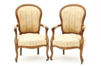 Lot 339 - A pair of carved mahogany open arm chairs