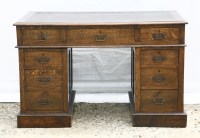 Lot 403 - An Edwardian oak twin pedestal desk