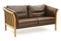Lot 401 - A Danish two seater brown leather settee