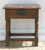 Lot 452 - An oak stool with a hinged top