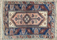 Lot 384 - A blue ground Caucasian rug