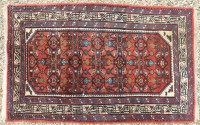 Lot 389 - Two red ground Caucasian rugs