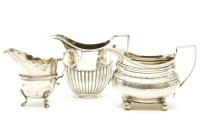 Lot 107 - A George III silver and bright cut cream jug on ball feet