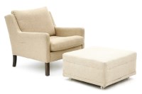 Lot 371 - A Danish cream upholstered armchair and ottoman