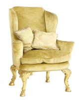 Lot 406 - An early 20th century wing armchair