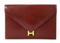 Lot 1126 - An Hermès 'Liddy' oxblood red clutch handbag