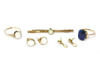 Lot 82 - A gold single stone opal doublet ring