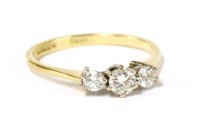 Lot 69 - An 18ct gold three stone diamond ring