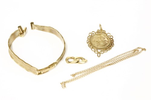 Lot 49 - A gold George and the Dragon medallion in scroll mount (tested as approximately 9ct)