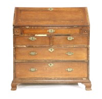 Lot 517 - A George III mahogany and crossbanded bureau