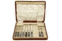 Lot 144 - A part set of silver and agate handled knives and forks