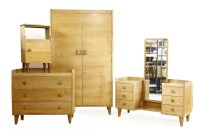 Lot 414 - A Gordon Russell oak bedroom suite