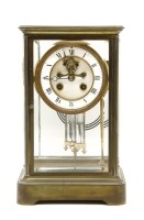 Lot 287 - A French brass four glass mantel clock
