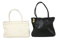 Lot 1179 - A Chanel white canvas tote